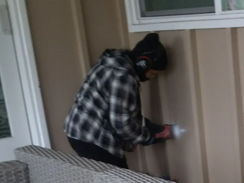 Professional electrician installing an exterior outlet in Dalhart