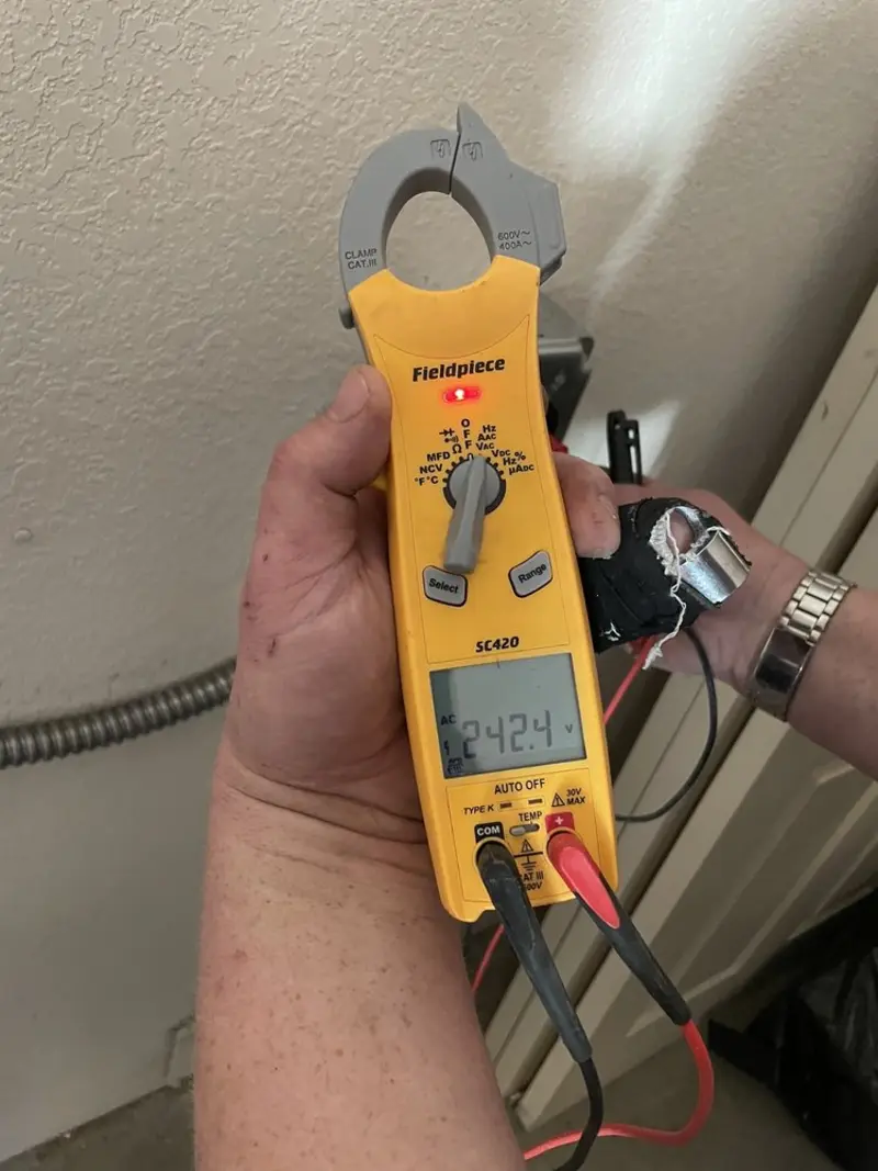 Voltage testing with clamp meter during Electrical Installation Services in Dalhart